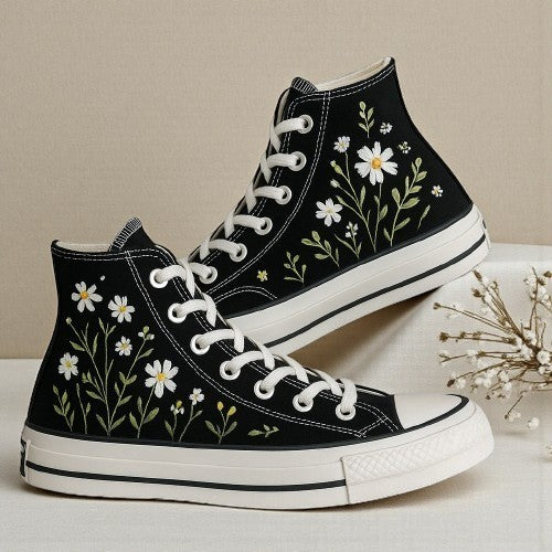 Black Converse shoes featuring vibrant flower converse embroidery for a trendy look