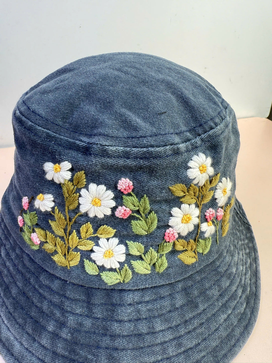 Flower Garden Hand Embroidered Bucket Hat by Stitchery Zone with white daisies and pink floral design