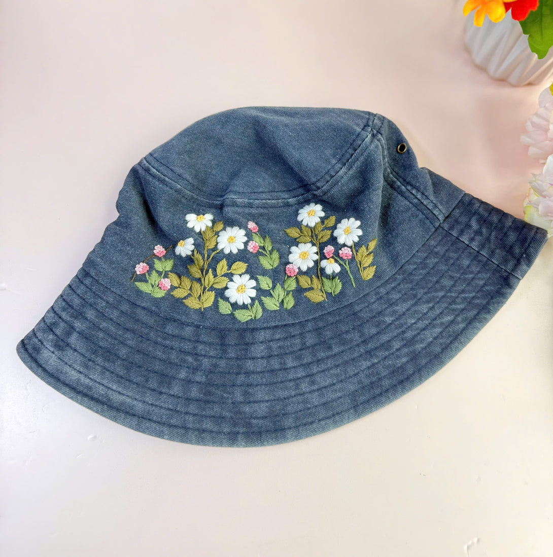 Flower Garden Hand Embroidered Bucket Hat in blue denim with white and pink floral design by Stitchery Zone