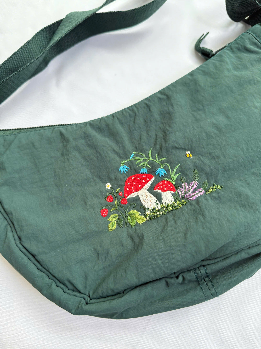 Stitchery Zone Flower Garden Hand Embroidered Cross Bag in green with colorful mushroom and floral design