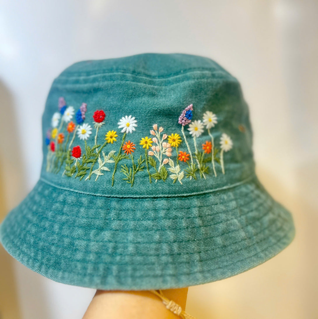Flower Hand Embroidered Bucket Hat by Stitchery Zone with colorful floral designs on teal fabric