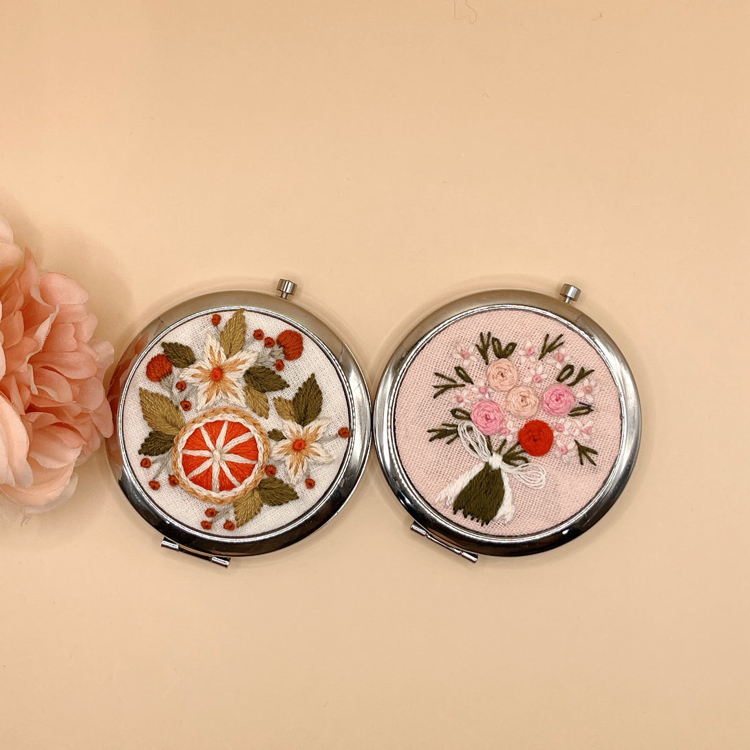 Handmade Embroidered Small Mirror set with floral embroidery by Stitchery Zone featuring a white flower and pink bouquet design
