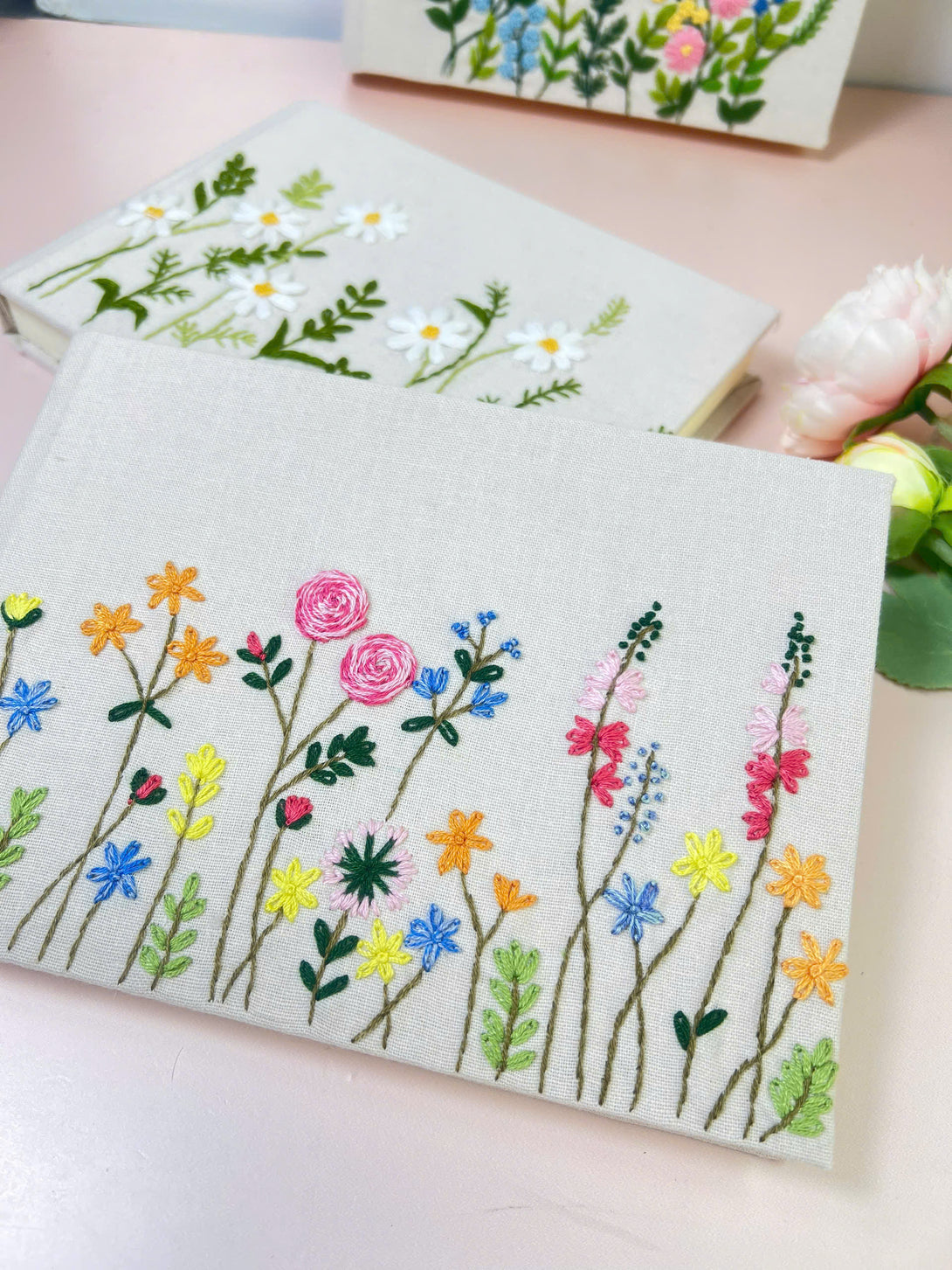 Handmade Wedding Guest Book notebook with colorful embroidered wildflowers on fabric cover by Stitchery Zone