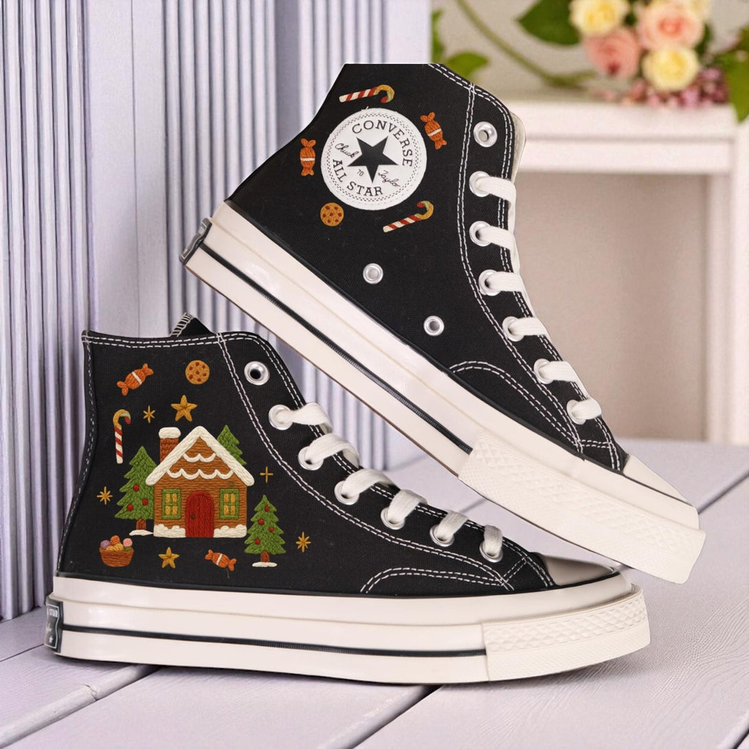 Black embroidered high top Christmas Converse with gingerbread house candy cane cookie motifs