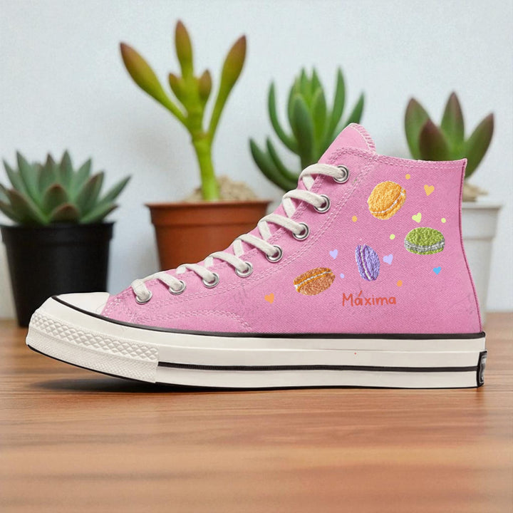 Pink embroidered high top Hello Kitty Converse shoe with colorful macaron motifs and embroidered Maxima name