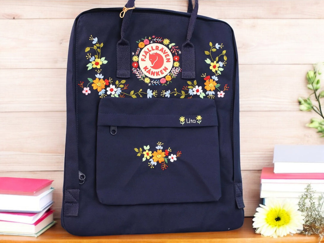 Stitchery Zone embroidered school backpacks in navy with floral designs and front pocket
