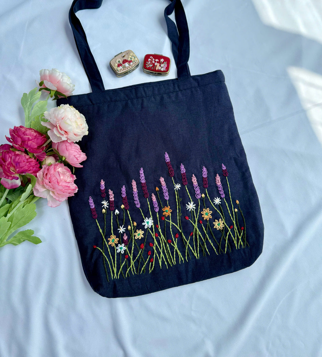 Lavender Garden Hand Embroidered Tote Bag with colorful floral design on navy fabric from Stitchery Zone