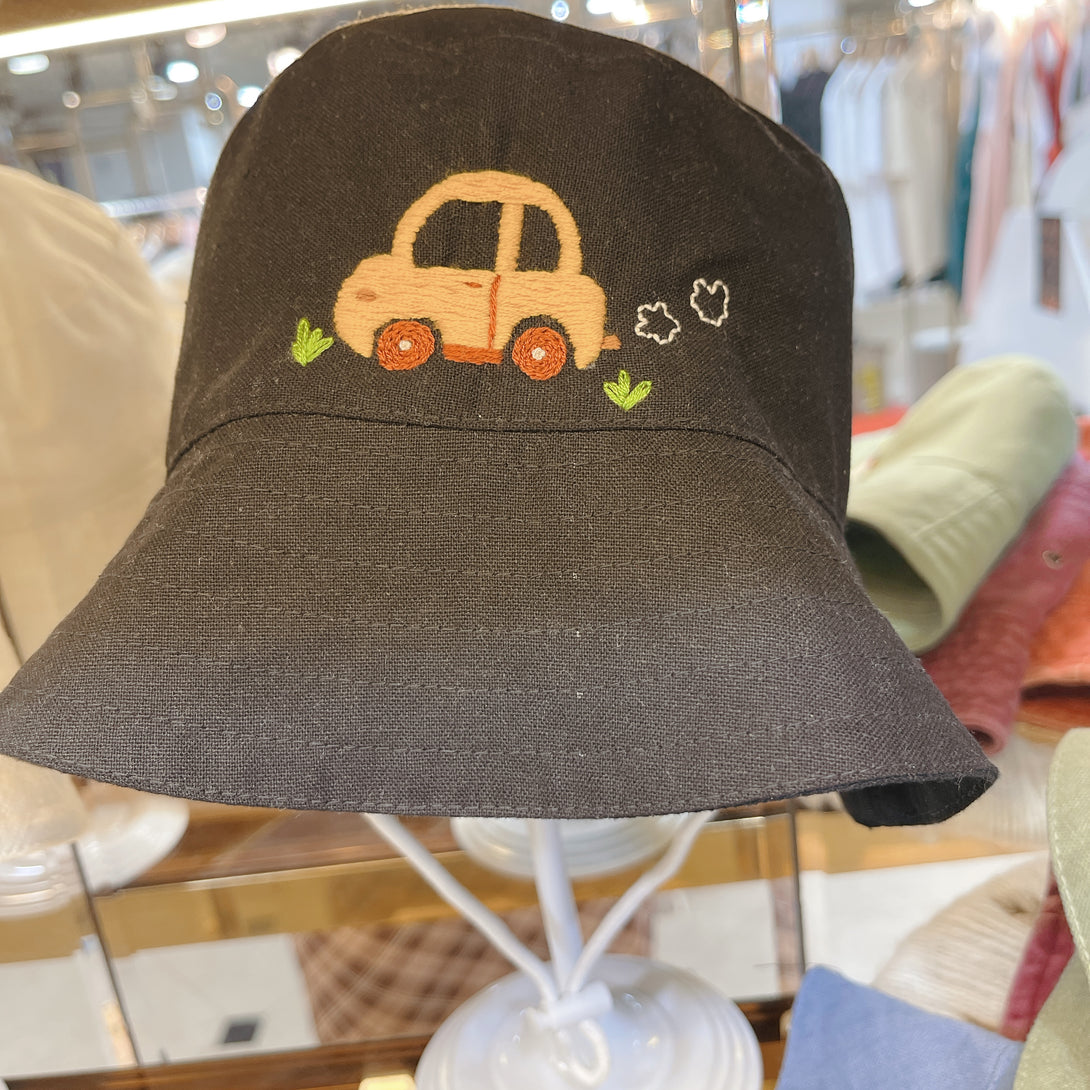 Little Embroidered Linen Baby Hat in black with cute embroidered car design by Stitchery Zone