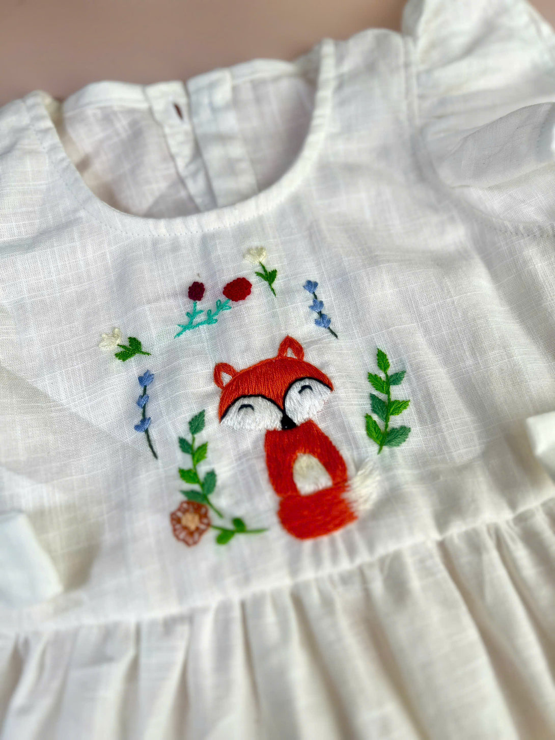 Little fox cotton dress by Stitchery Zone with embroidered red fox and floral design on white fabric