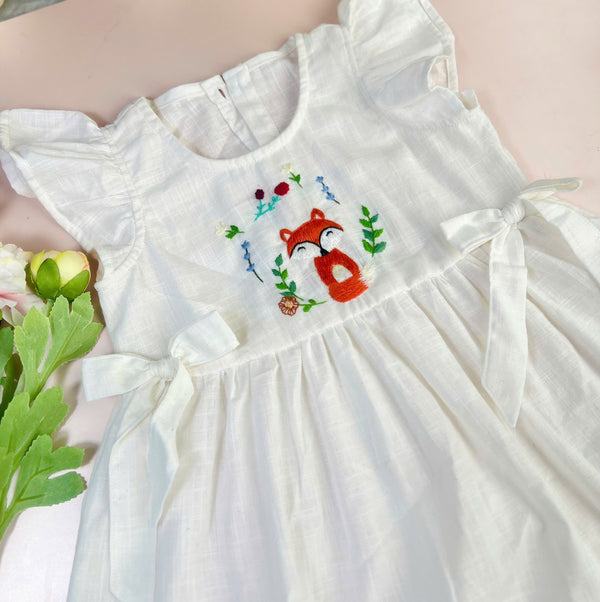 White stitched little fox cotton dress with flutter sleeves and floral embroidery by Stitchery Zone