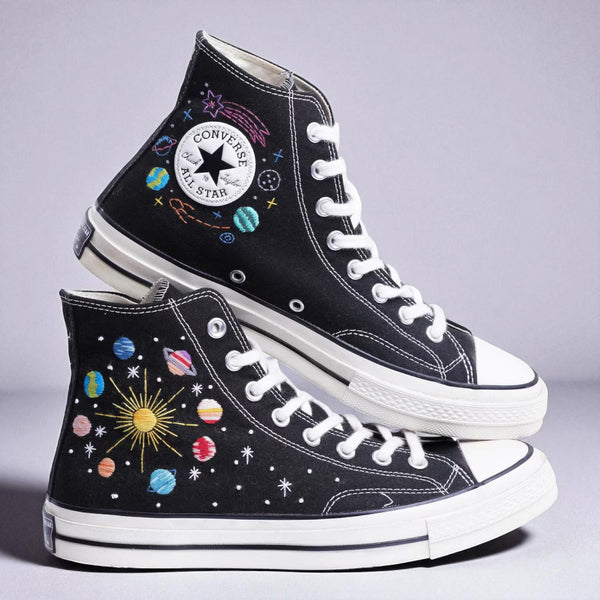 Moon Converse high-top shoes featuring colorful embroidered space designs and star motifs