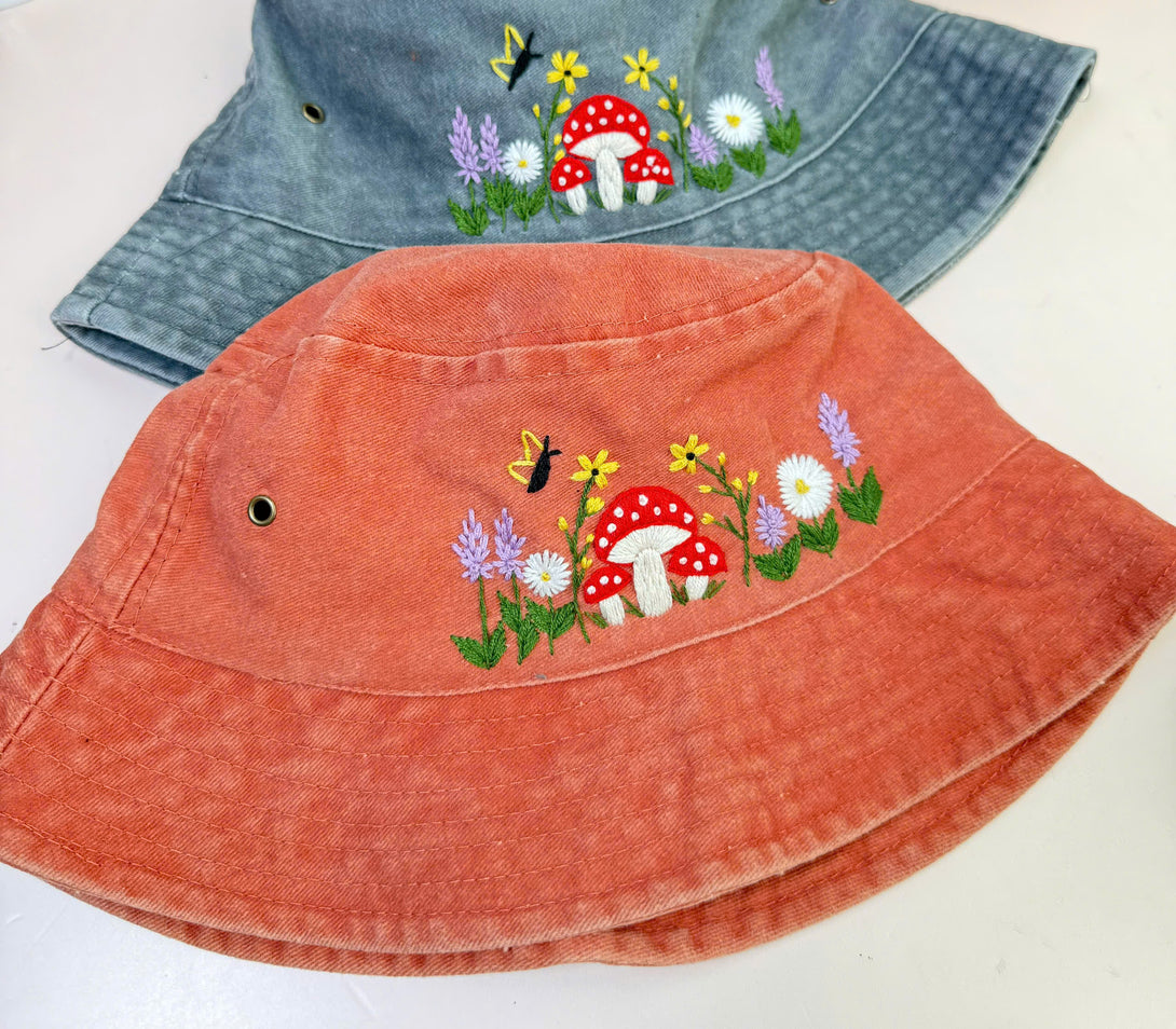 Mushroom And Flowers Hand Embroidered Bucket Hat in orange and blue by Stitchery Zone