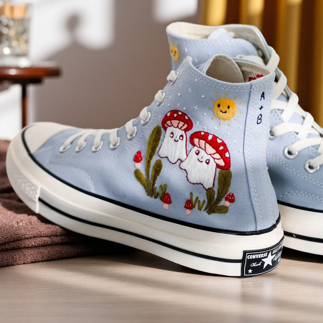 Mushroom Converse high-top shoes with colorful embroidered mushroom design on light blue canvas
