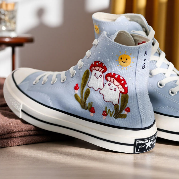 Mushroom Converse high-top shoes with colorful embroidered mushroom design on light blue canvas