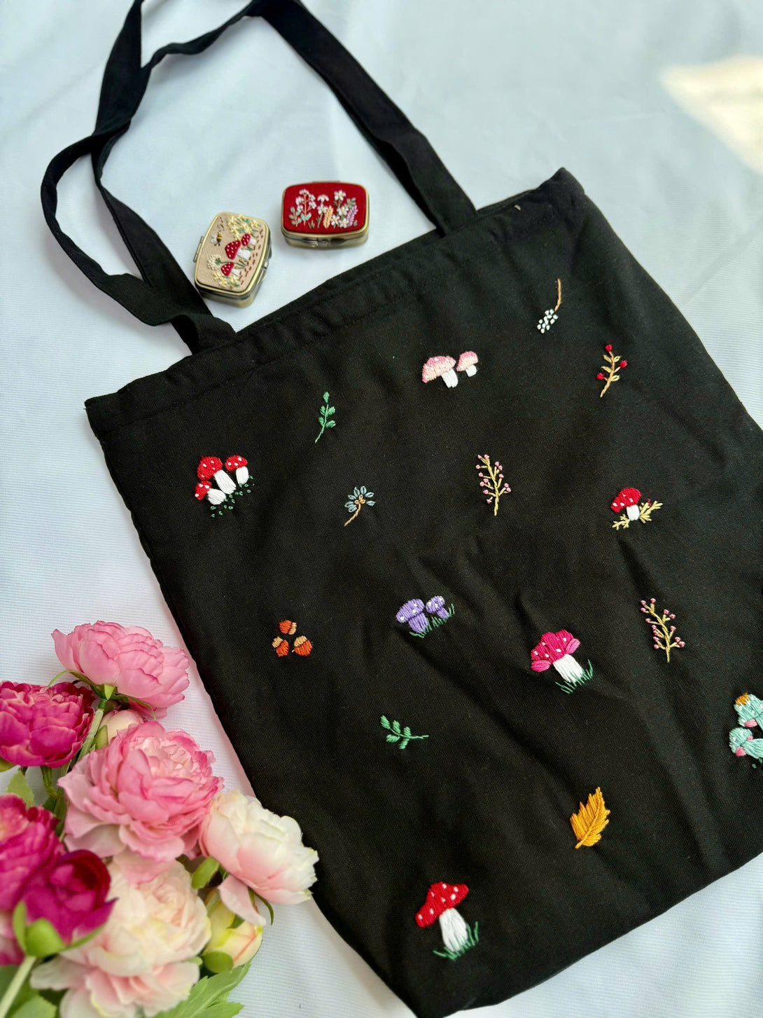 Black Mushroom Embroidered Tote Bag by Stitchery Zone with colorful mushroom and floral designs