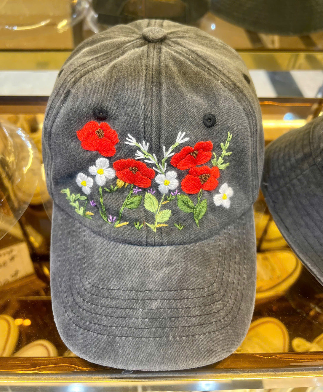 Peonies Hand Embroidered Hat by Stitchery Zone featuring red and white floral embroidery on a gray cap