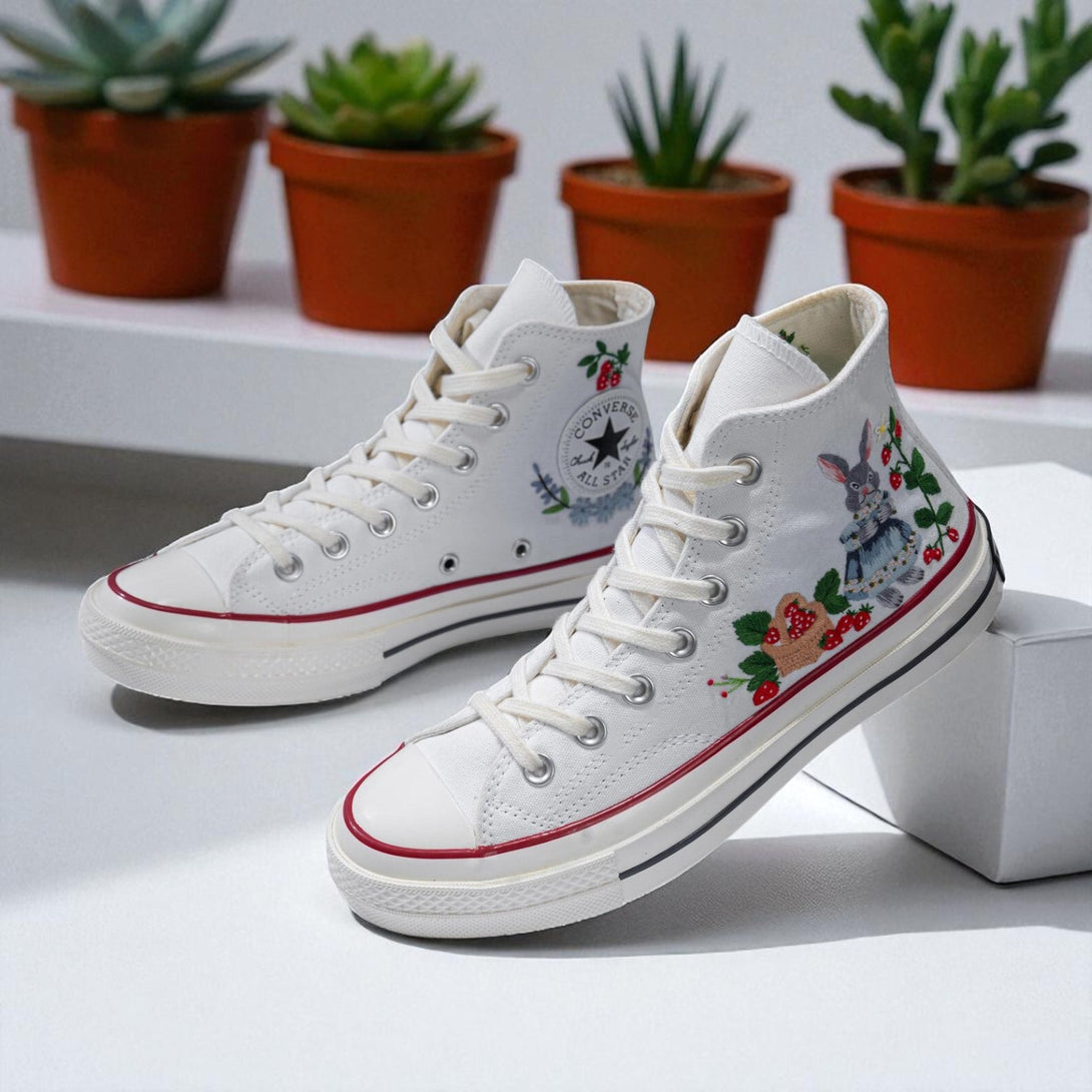 Strawberry Converse embroidered shoes featuring floral designs and classic high-top silhouette