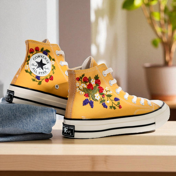 Stylish yellow Strawberry Converse shoes with embroidered fruit designs perfect for casual outfits