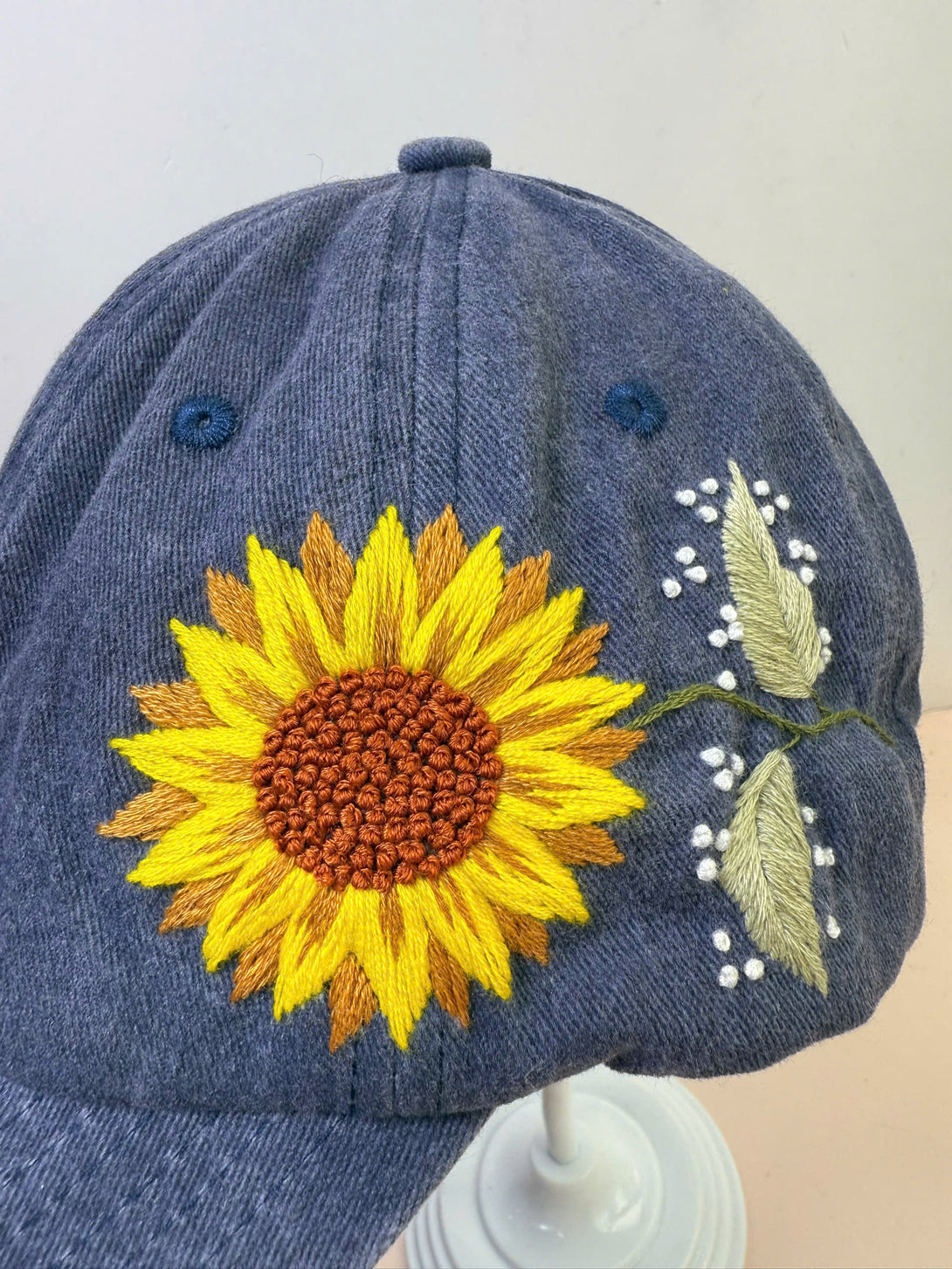 Stitchery Zone Sunflower Embroidered Hat in blue with yellow sunflower and leaf design