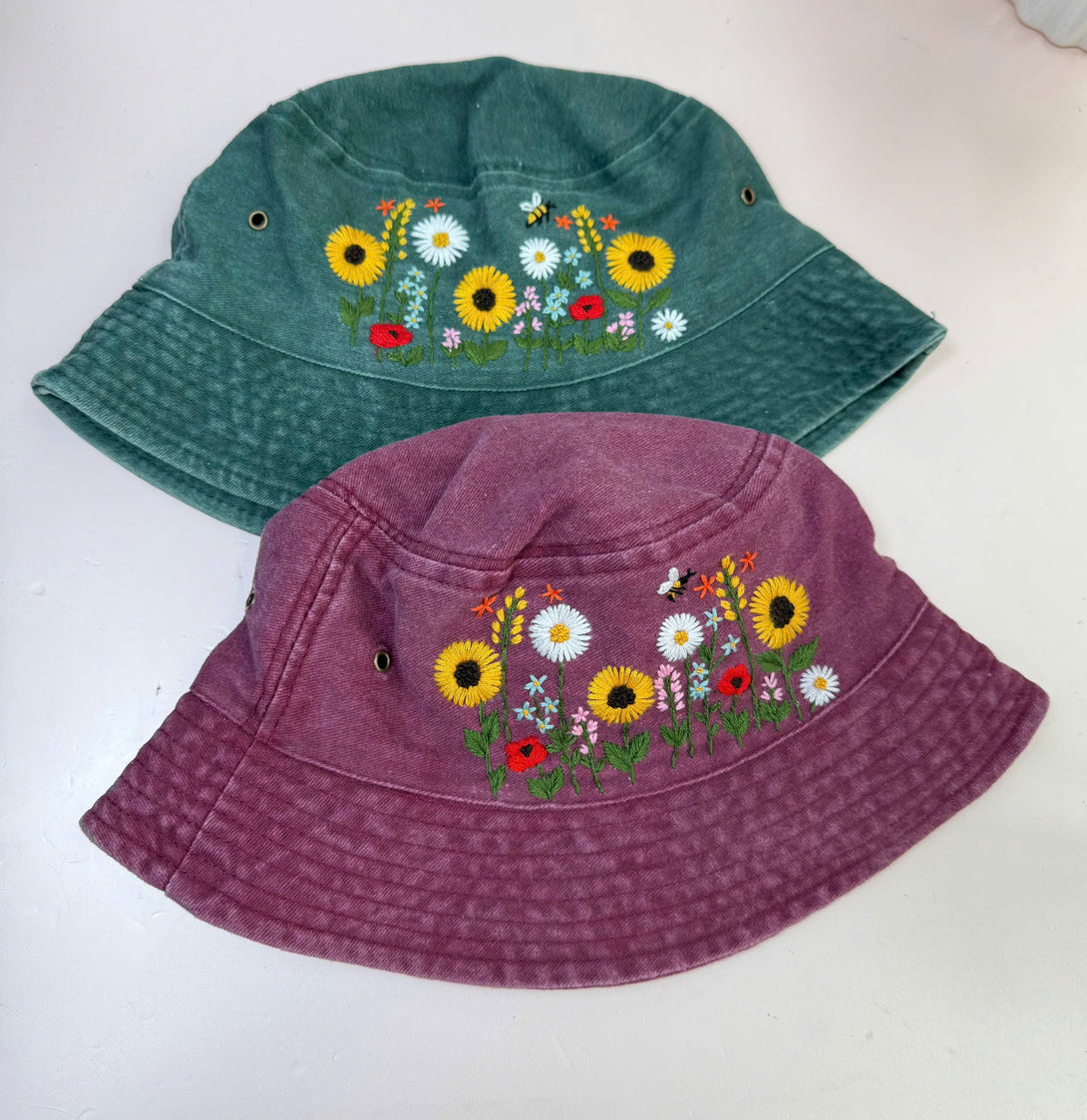 Sunflower Hand Embroidered Bucket Hat in green and purple with colorful floral designs by Stitchery Zone
