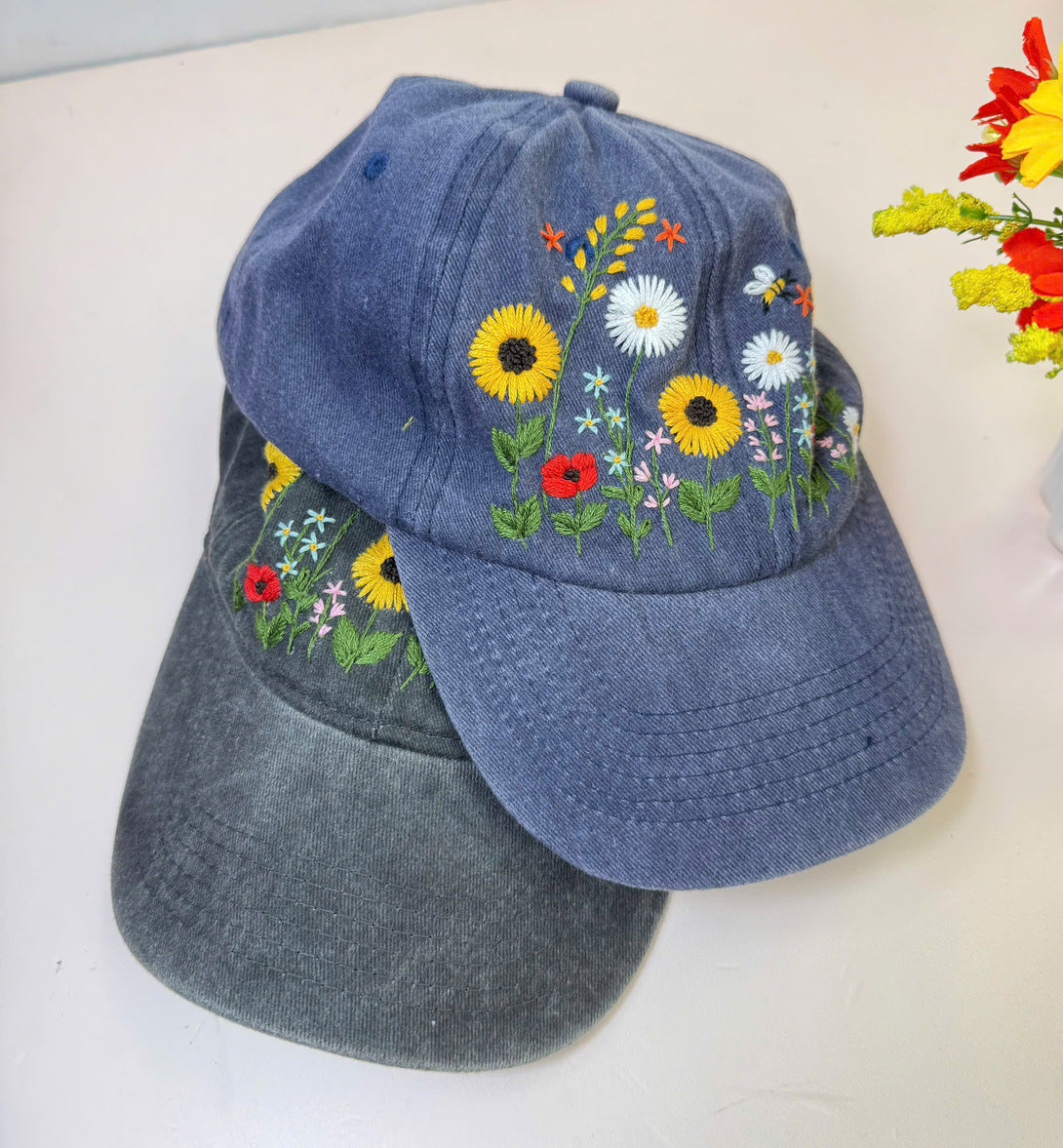 Stitchery Zone Sunflower Hand Embroidered Hat in blue with colorful floral embroidery design