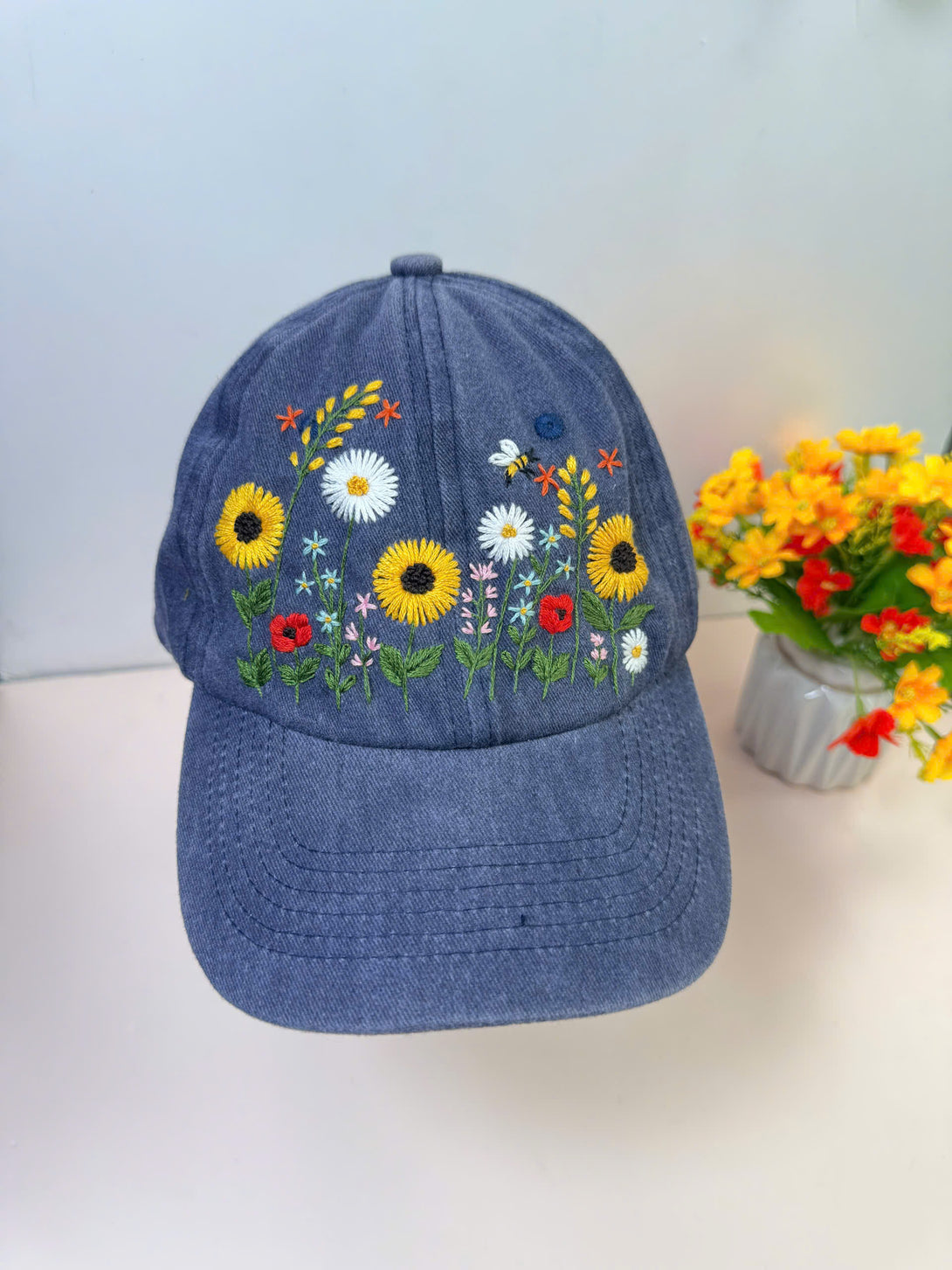 Stitchery Zone Sunflower Hand Embroidered Hat in blue with detailed floral embroidery