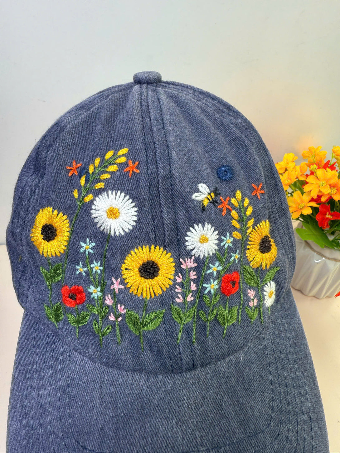 Stitchery Zone Sunflower Hand Embroidered Hat in denim with colorful floral and bee design
