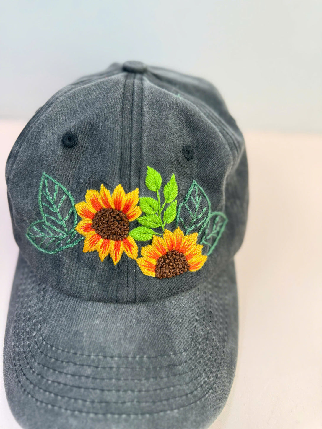 Stitchery Zone Sunflower Personalised Embroidered Hat in dark gray with bright yellow sunflower design