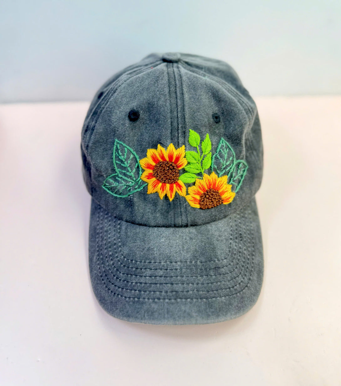 Sunflower Personalised Embroidered Hat in gray with bright yellow sunflowers and green leaves by Stitchery Zone