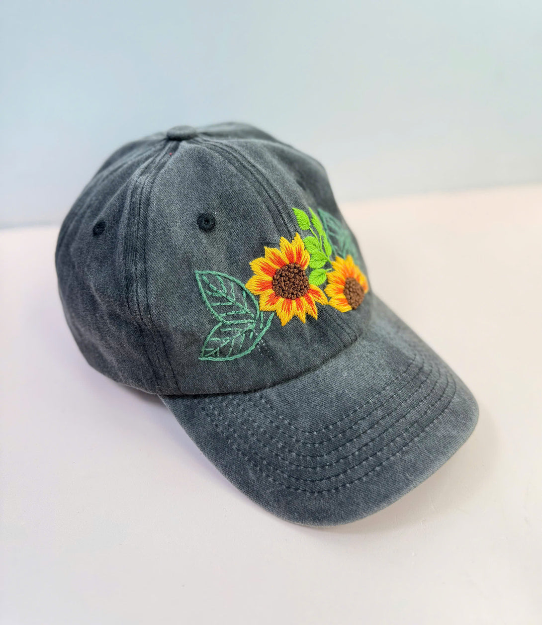 Sunflower Personalised Embroidered Hat by Stitchery Zone in faded black with bright sunflower design