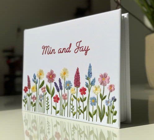 Unique Handmade Wedding Guest Book by Stitchery Zone with embroidered colorful wildflowers and personalized names