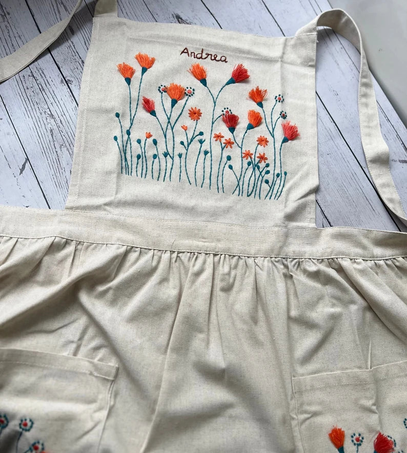Floral Embroidered Apron For Women by Stitchery Zone with orange and blue flower design on cream fabric