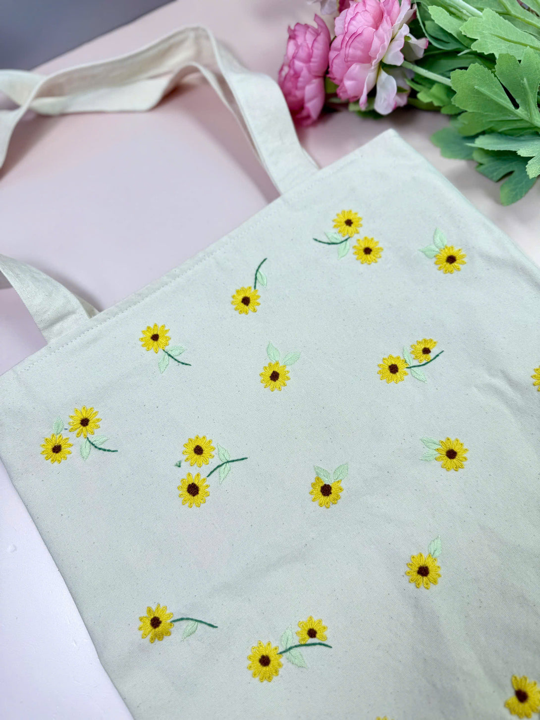 Handmade embroidered bag for women with yellow floral design and sturdy handles from Stitchery Zone