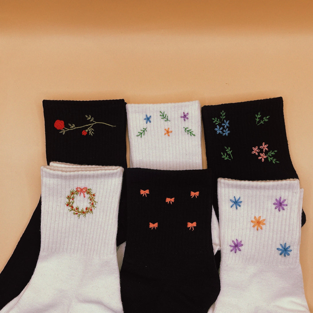 Tennis Socks Embroidered For Women with floral and bow designs in black and white colors