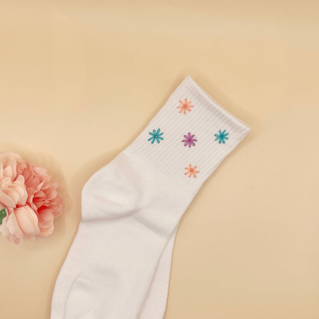 White Tennis Socks Embroidered For Women with colorful floral designs on the ankle