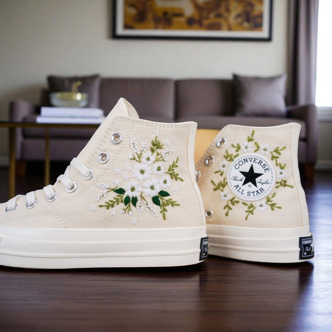 Stitchery Zone embroidered wedding tennis shoes for bride featuring white floral designs on beige high-top sneakers