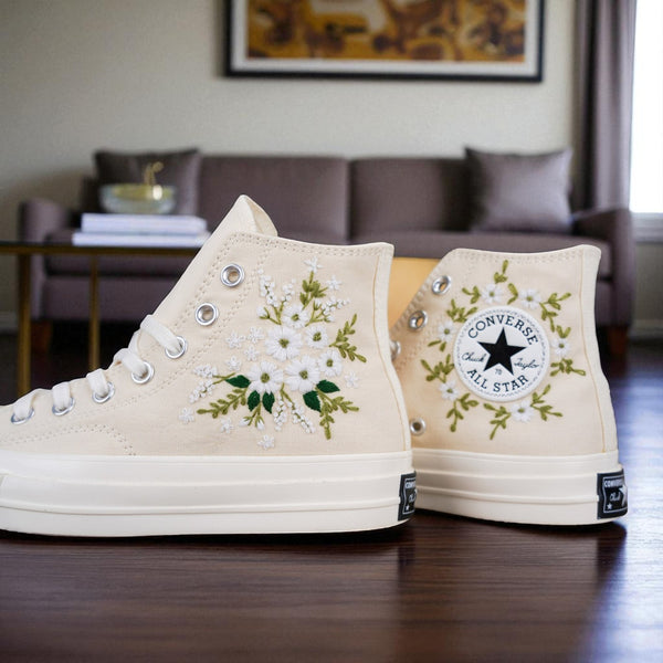 Stitchery Zone embroidered wedding tennis shoes for bride featuring white floral designs on beige high-top sneakers