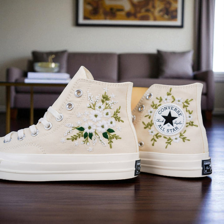 Stitchery Zone embroidered wedding tennis shoes for bride featuring white floral designs on beige high-top sneakers