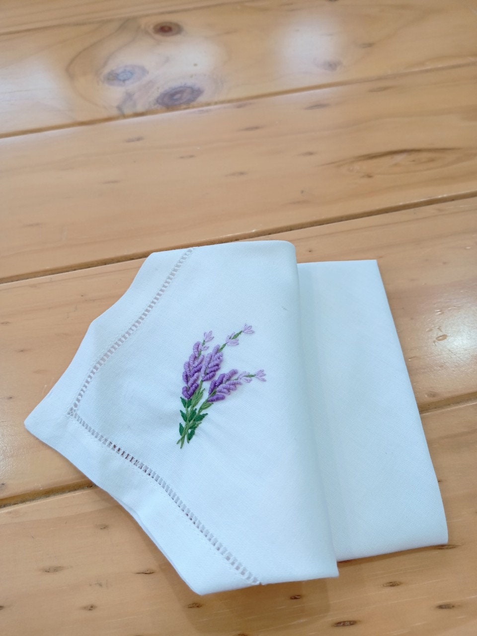 Stitchery Zone Wildflower Linen Dinner Napkins with purple floral embroidery on white linen