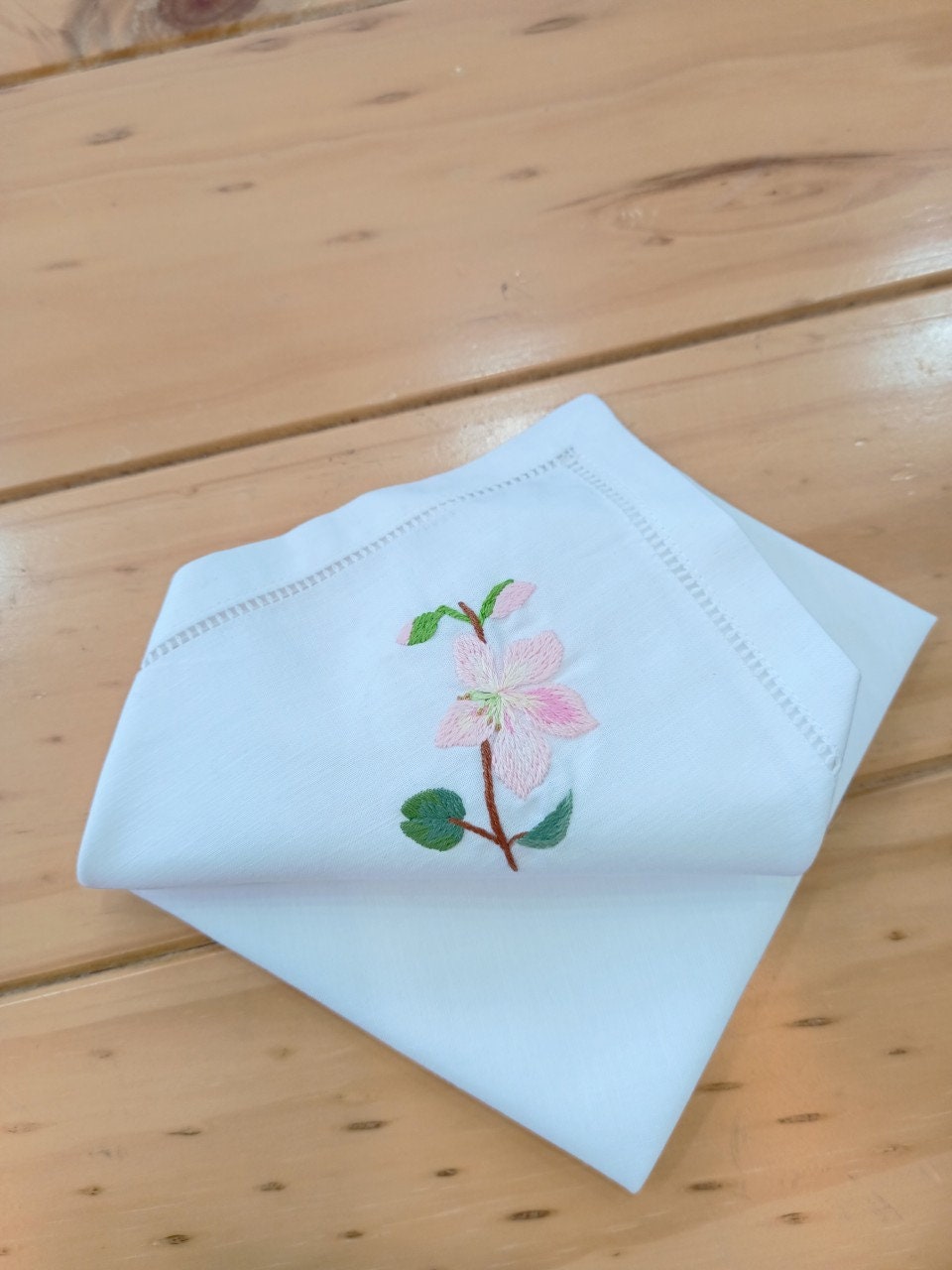 Wildflower Linen Dinner Napkins by Stitchery Zone with delicate pink flower embroidery on white linen