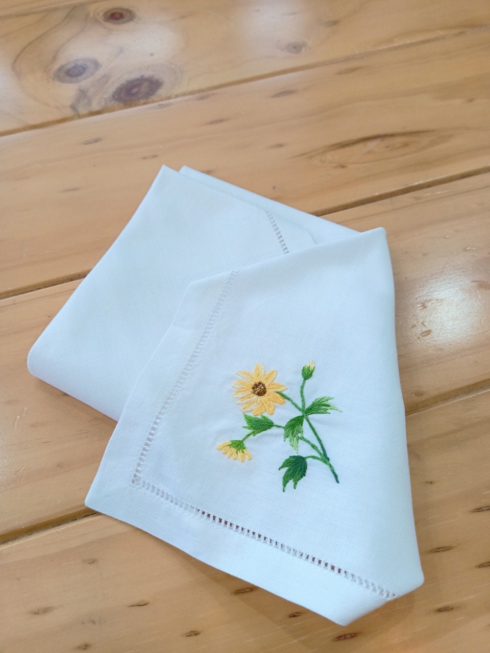 White Wildflower Linen Dinner Napkins with embroidered yellow flower from Stitchery Zone